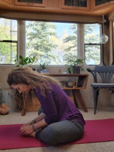 Forward folding in the butterfly pose stretches the innner thighs, hips and back.