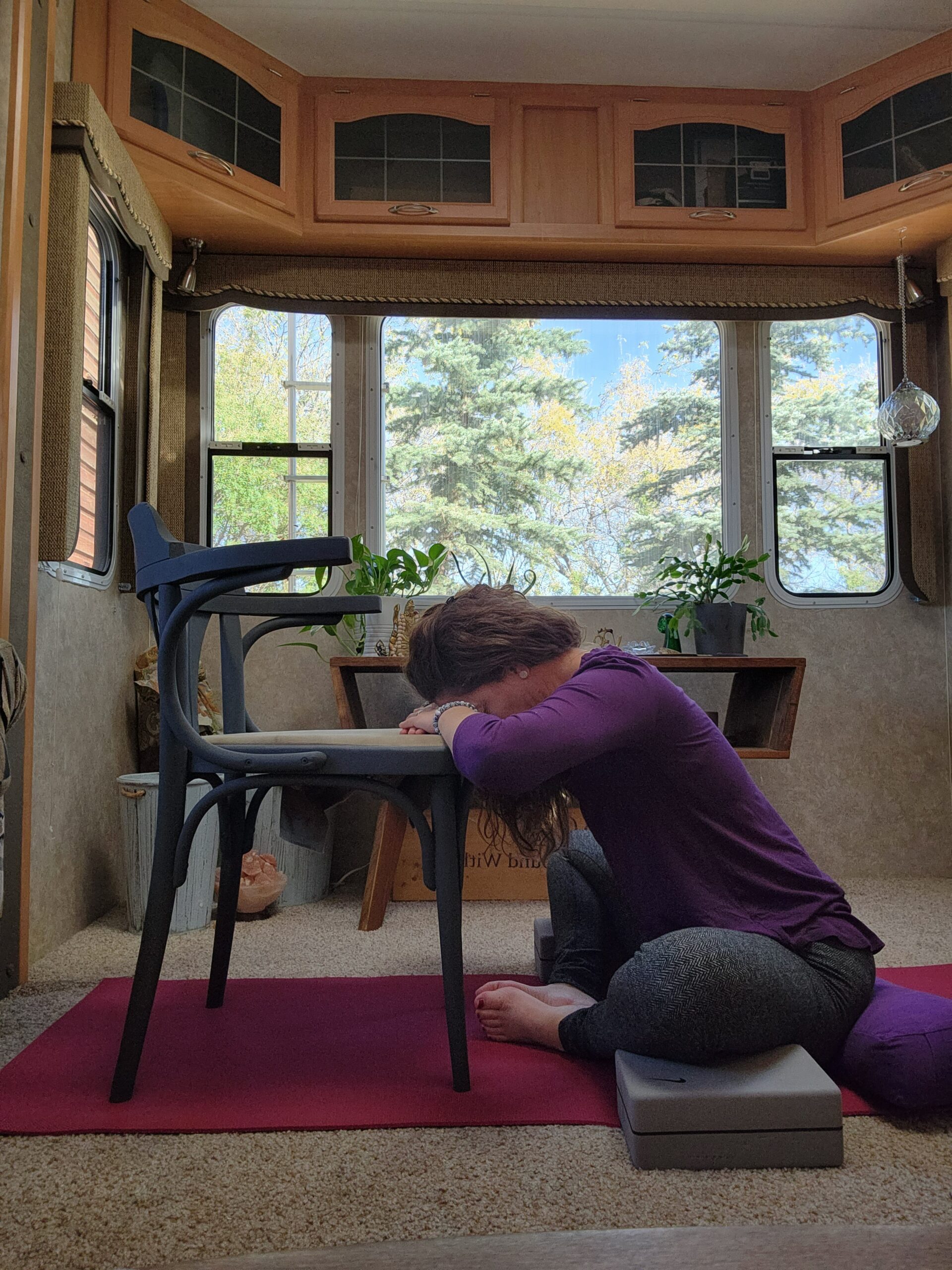 Using a chair or a bolster to support your upper body in Bhadrasana, creates a restorative yoga pose.